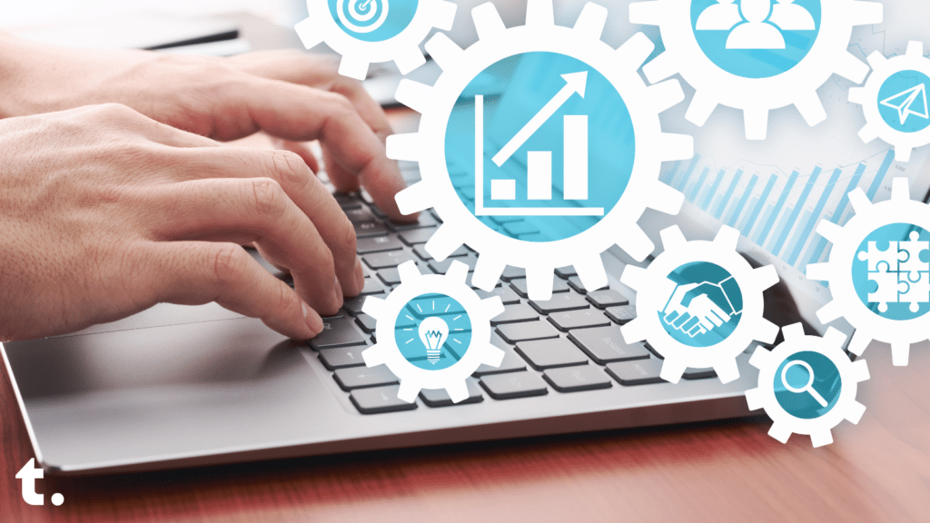 A person typing on a laptop with cogs with various symbols around it. The cogs include symbols such as an increasing bar chart, two hands shaking, a lightbulb, a group of people, a jigsaw and a magnifying glass